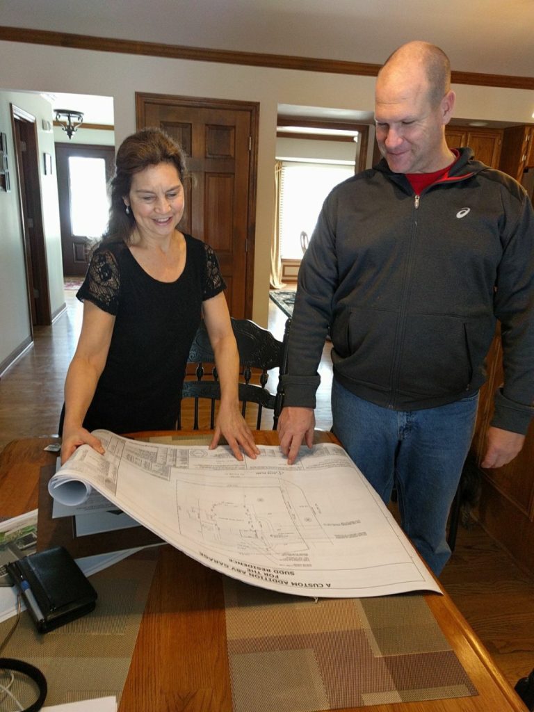Julie reviewing plans with a resident